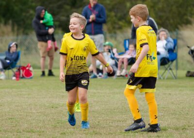 2 boys wearing bayside united jerseys